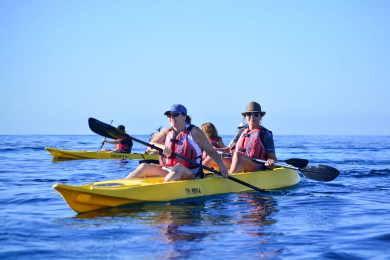 Transparent bottom kayak and snorkel in two bays